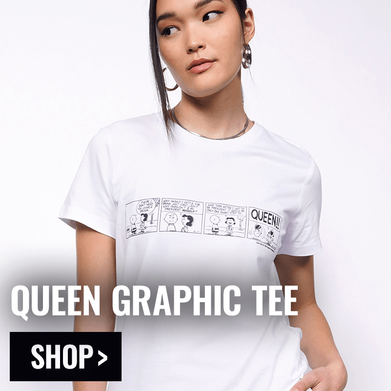 Person modeling the PEANUTS X WILDFANG Queen Graphic Tee with overlay text that reads QUEEN GRAPHIC TEE and button that reads SHOP.